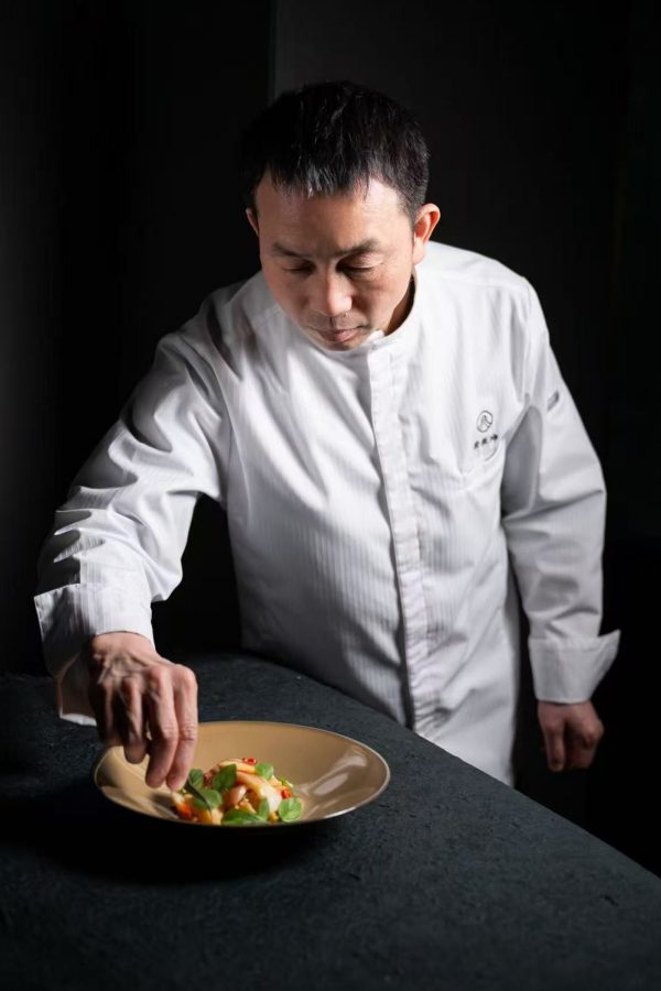 Chef Xu Zhen-kun of Gem Garden plating a dish.