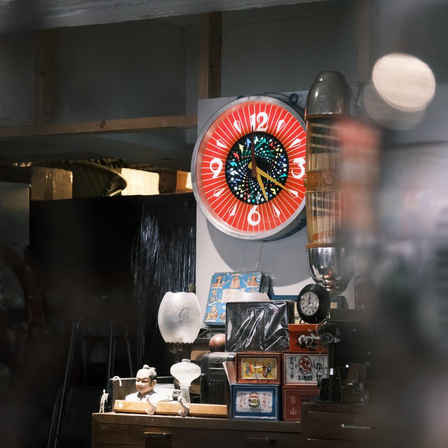 View of a retro wall clock and antiques at Jiksap in Hong Kong.