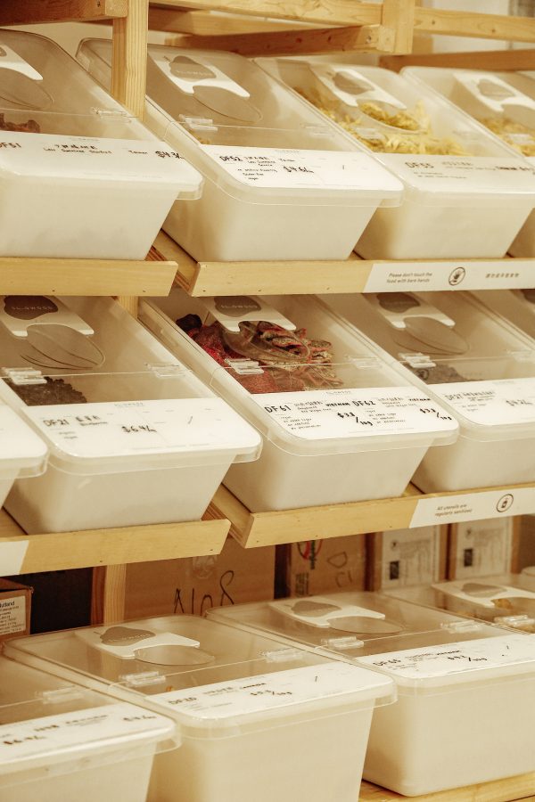 A view of various white boxes of dried goods sold at sustainable zero-waste store Slowood.