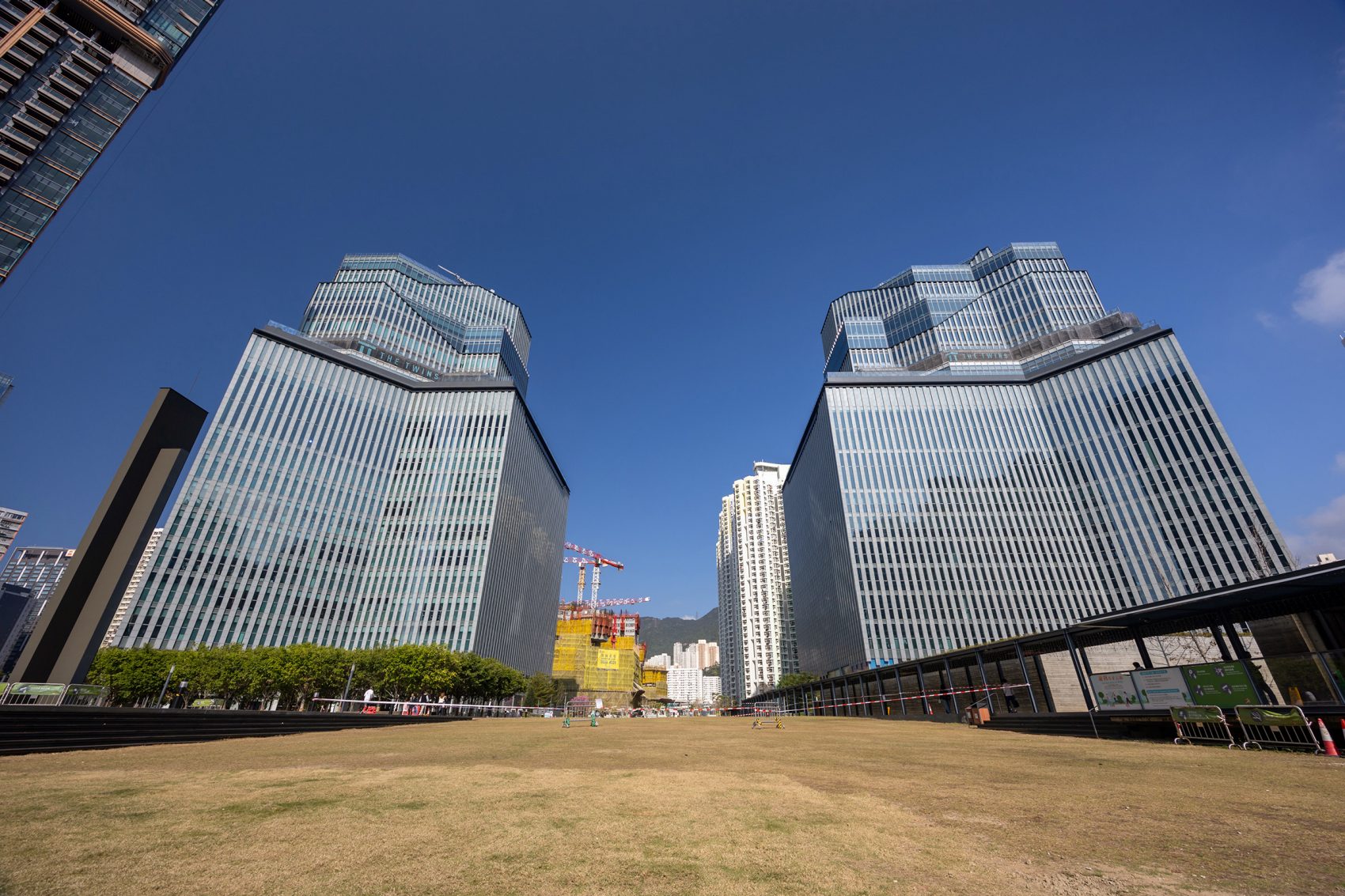 Exterior view of The Twins, Hong Kong, in the daytime.