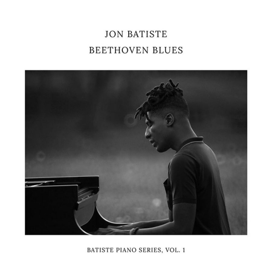 The album artwork for Beethoven Blues by Jon Batiste features a black and white photo of Batiste playing a piano. Above the photo reads the text “John Batiste Beethoven Blues”. Below reads the text “Batiste Piano Series Vol. 1”. 