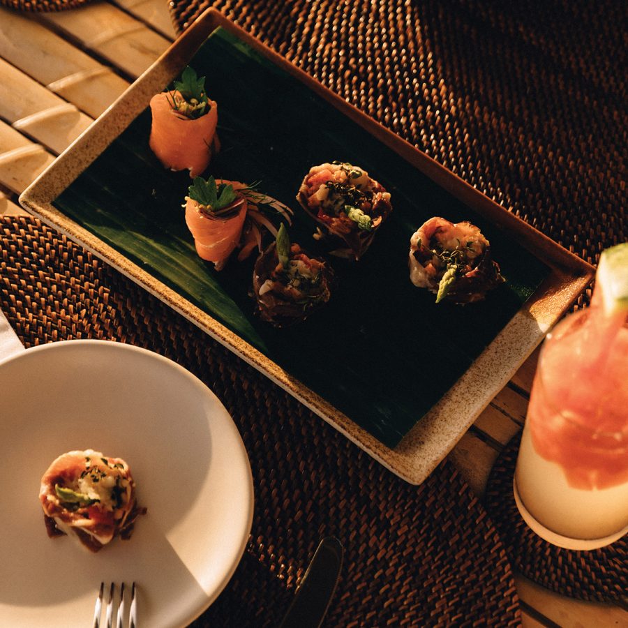 Flatlay of canapes and cocktails at Amanpulo Philippines