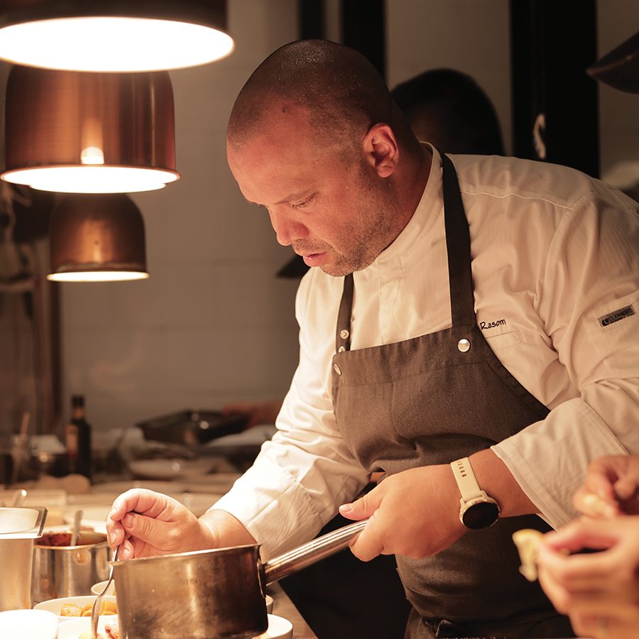 Chef Alessio Rasom of Si Dining puts the finishing touches on a plate. 