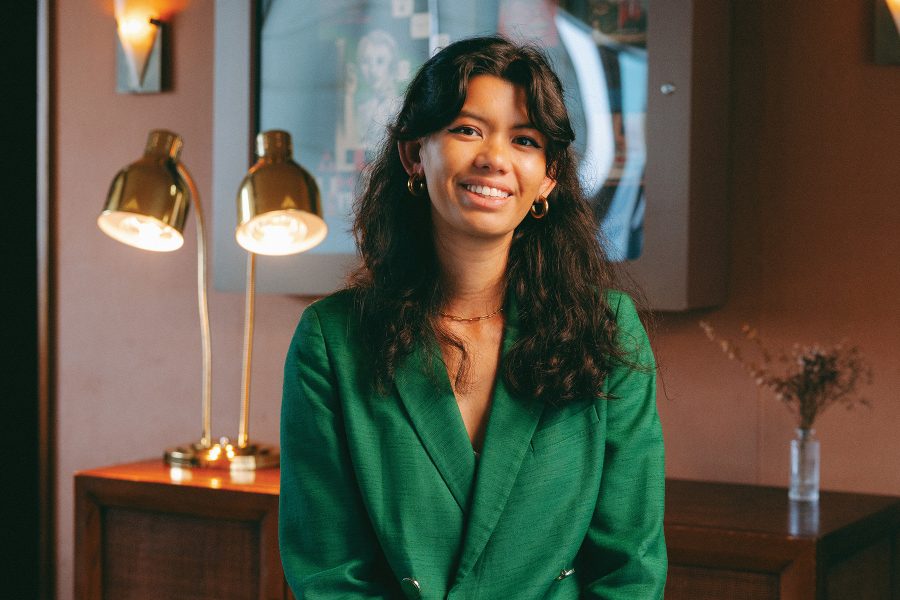 Carla Martinesi is pictured smiling in a green jacket at Soho House.
