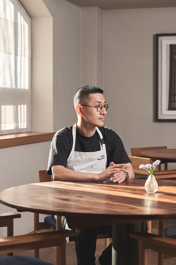 Close up shot of the chef at Hansik Goo sitting by a window
