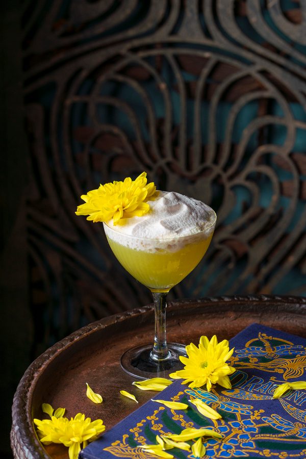 Close up shot of a yellow cocktail at Dragonfly