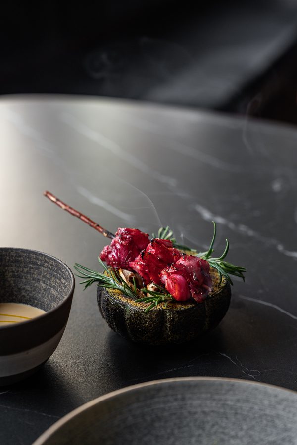 Small scarlet fine dining dish served at Feuille
