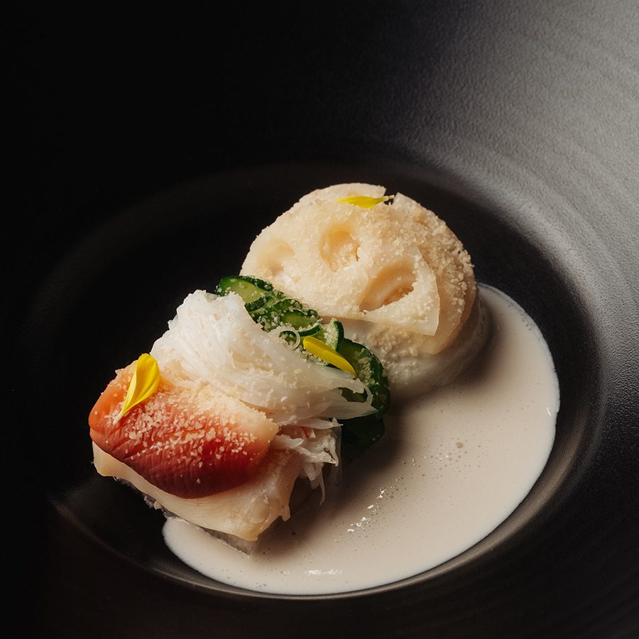 Fish dish at Hansik Goo on a black plate