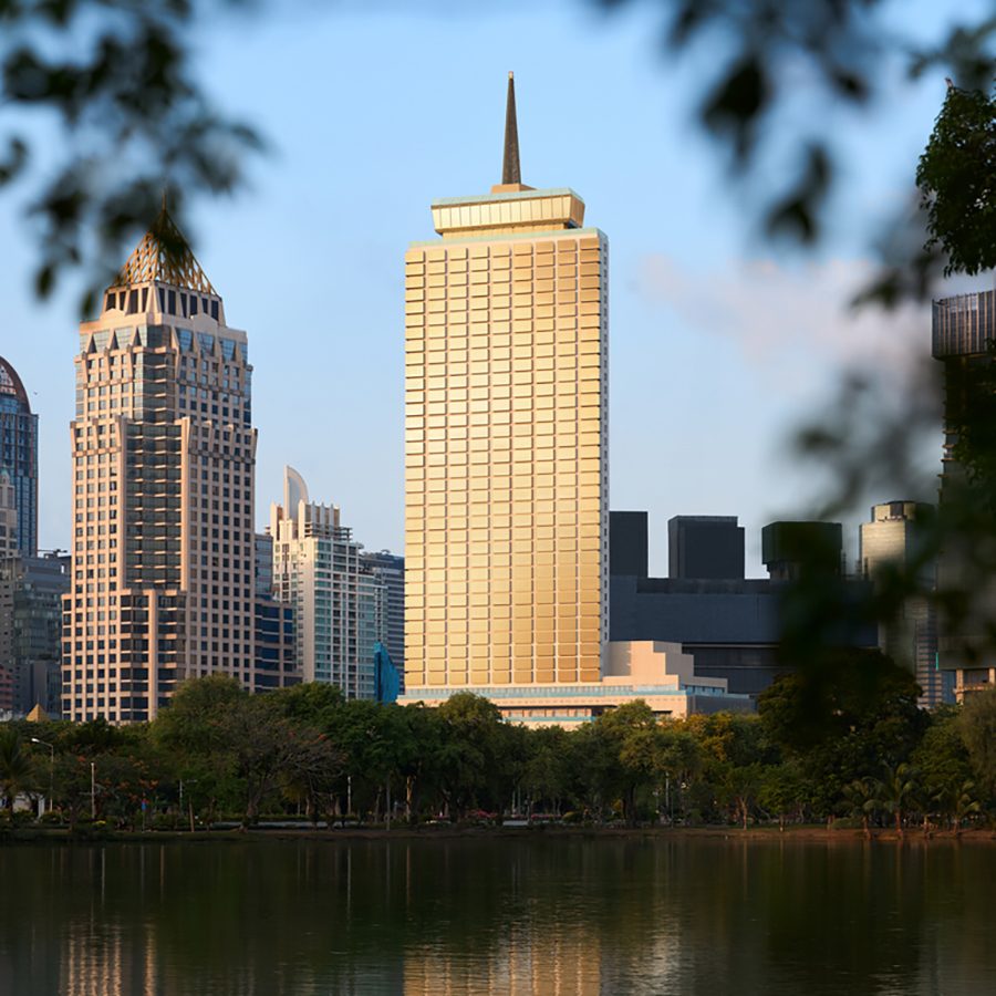 A view of the extrior of Dusit Thani Bangkok during daytime from a distance