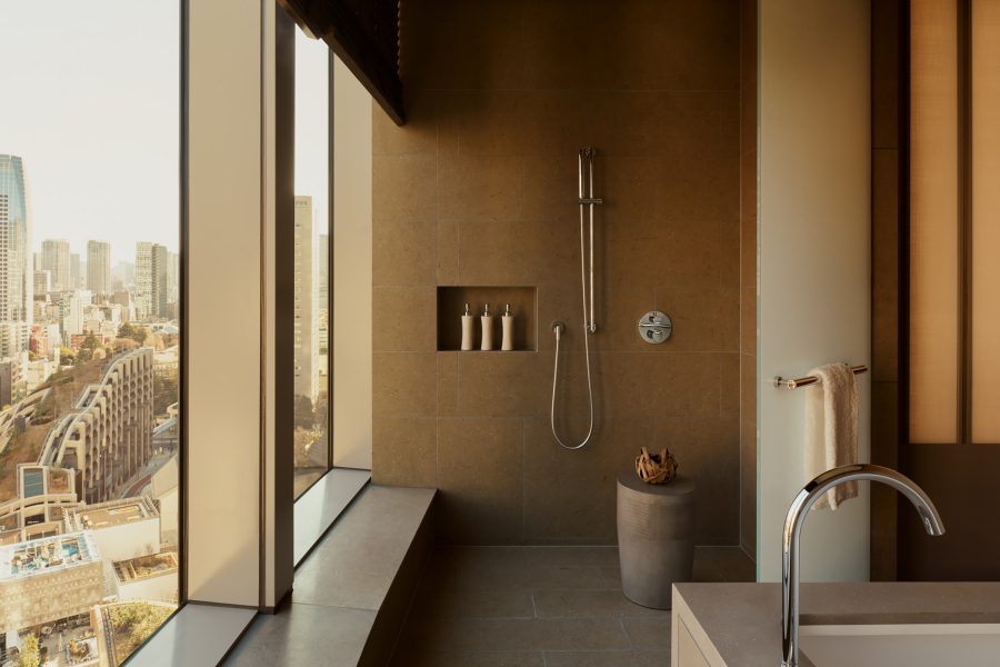 A shower room at Janu Tokyo uses refillable bath amenities.