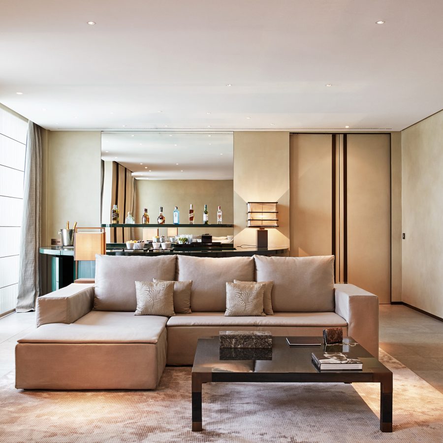Spacious, neutral-coloured guest suite at Armani Hotel Milano.