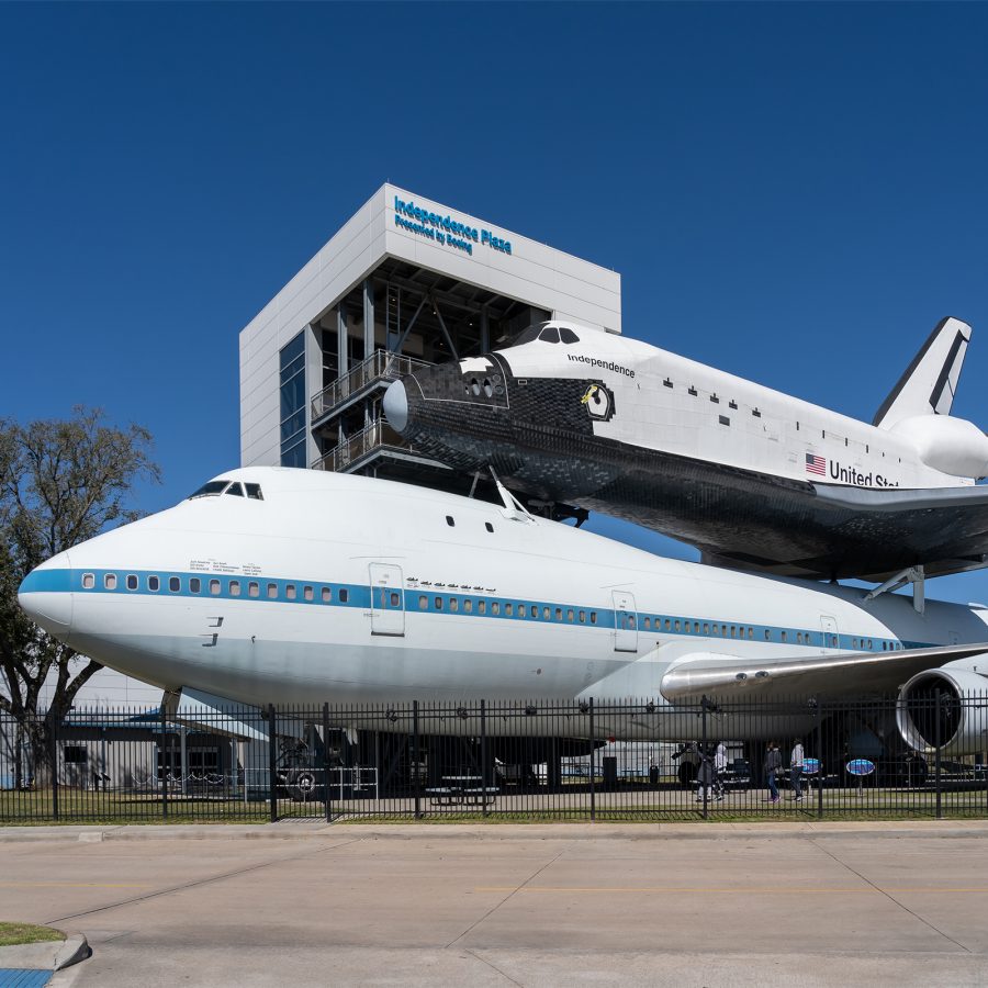 A space shuttle mounted on a shuttle carrier aircraft at Independence Plaza in Houston. 