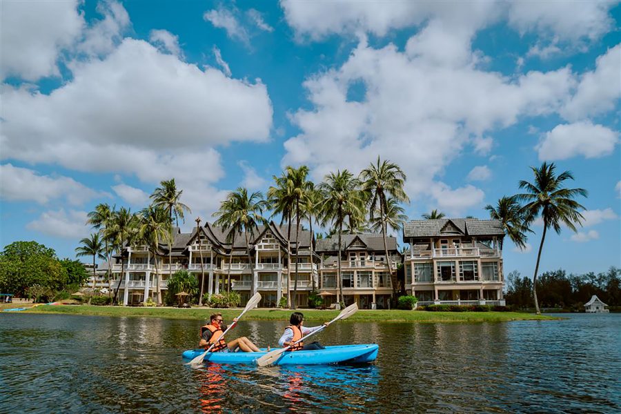 Two people kayaking at Angsana Laguna Phuket in the daytime. 