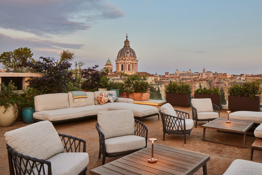 A city view of Rome on an outdoor rooftop terrace at Bulgari Hotel Roma.
