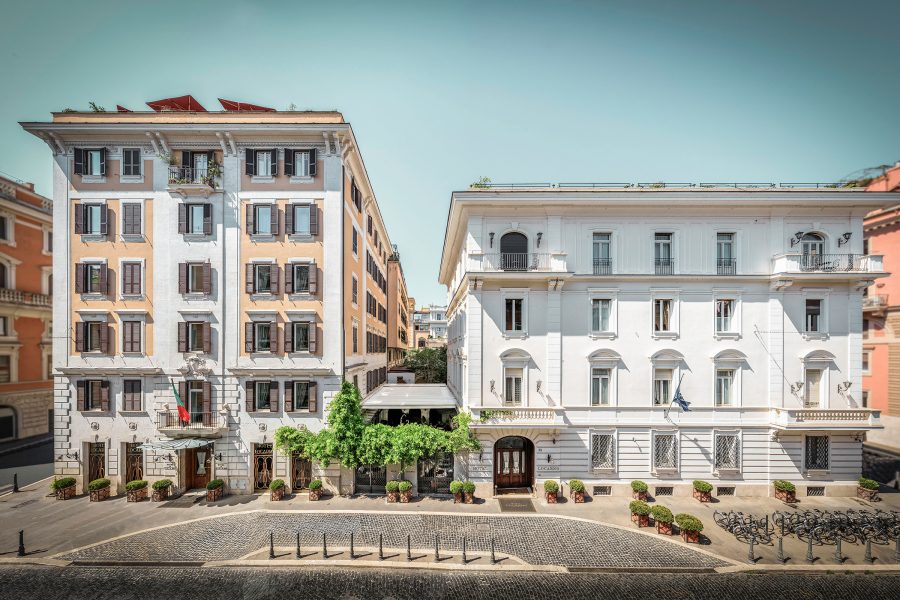 An exterior view of Hotel Locarno in Rome on a sunny day.