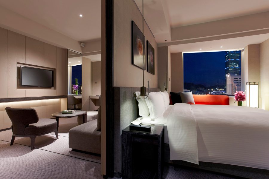 View of bed and lounge area at a hotel room in Humble House.