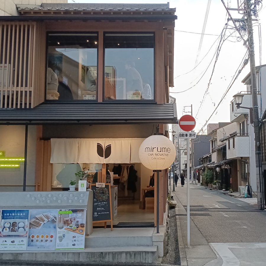 Exterior of Mirume, a two-storey tea shop on the corner of a street in Nagoya, Japan.
