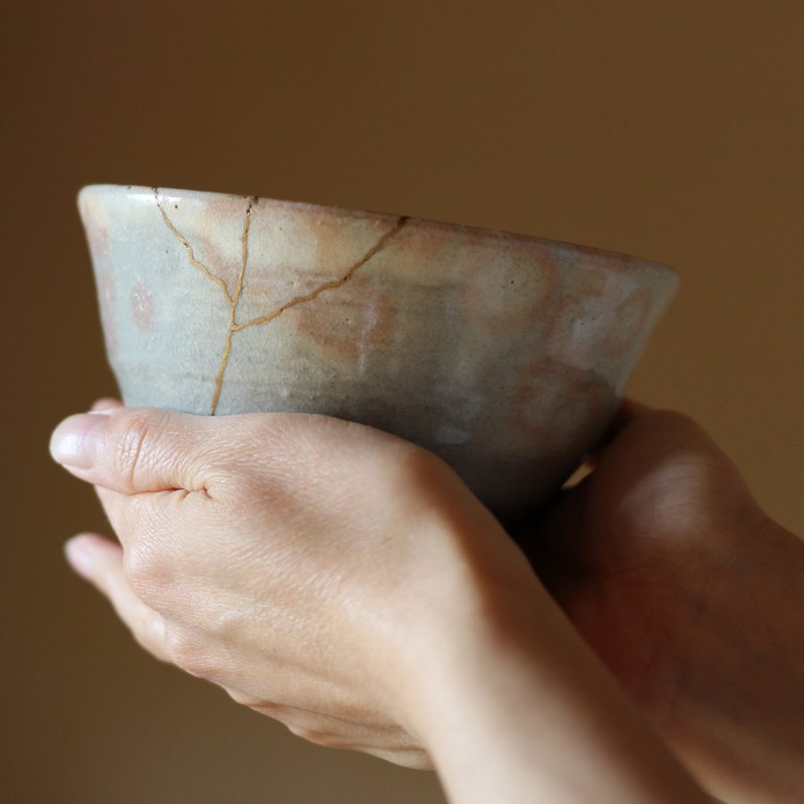 A person holds up a ceramic bowl, a popular item to shop for in Sapporo. 