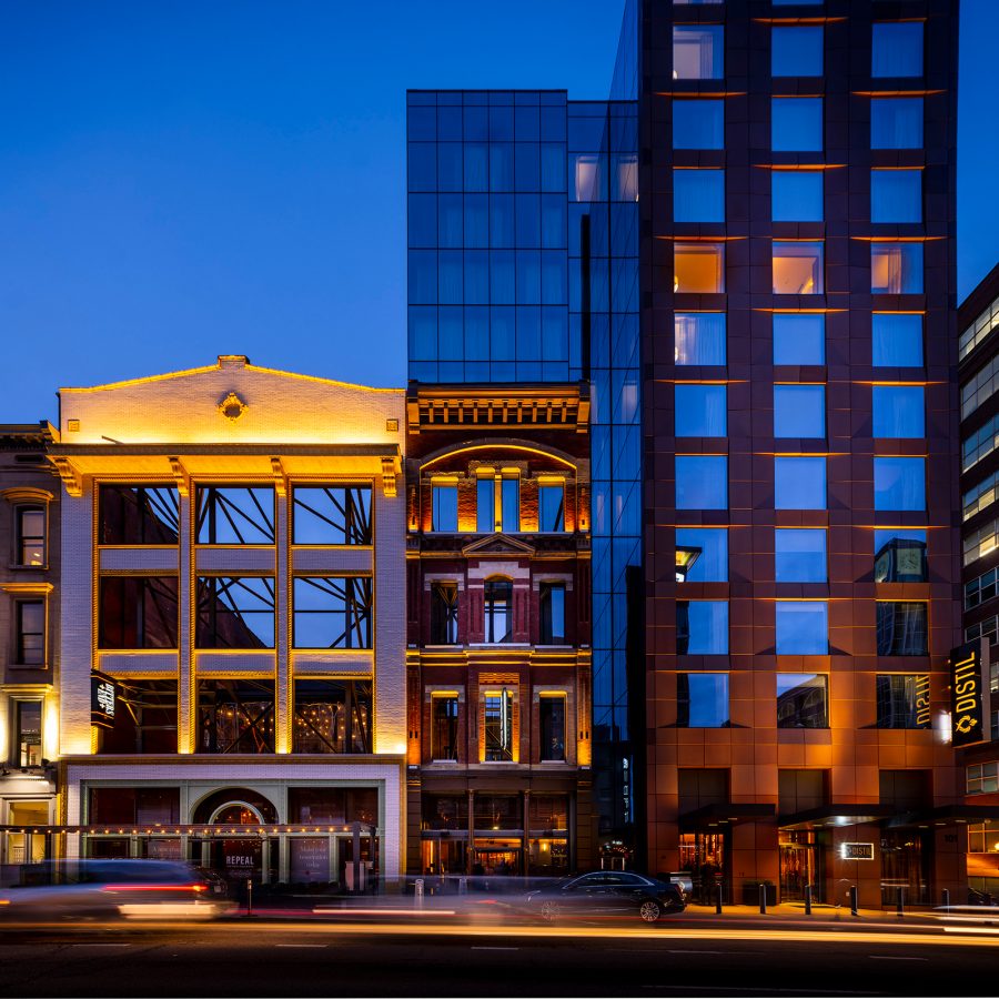 A view of the Hotel Distil in Louisville tucked between buildings.