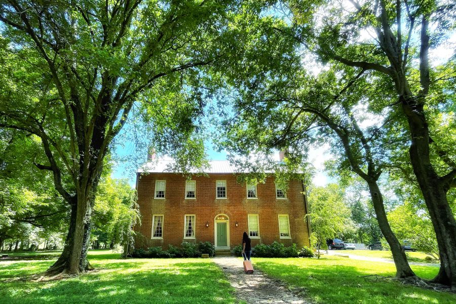 Exterior view of The Samuels House in Kentucky surrounded by trees and greenery.