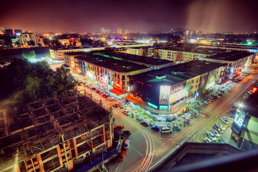 Busy intersection in Johor Bahru at night. 