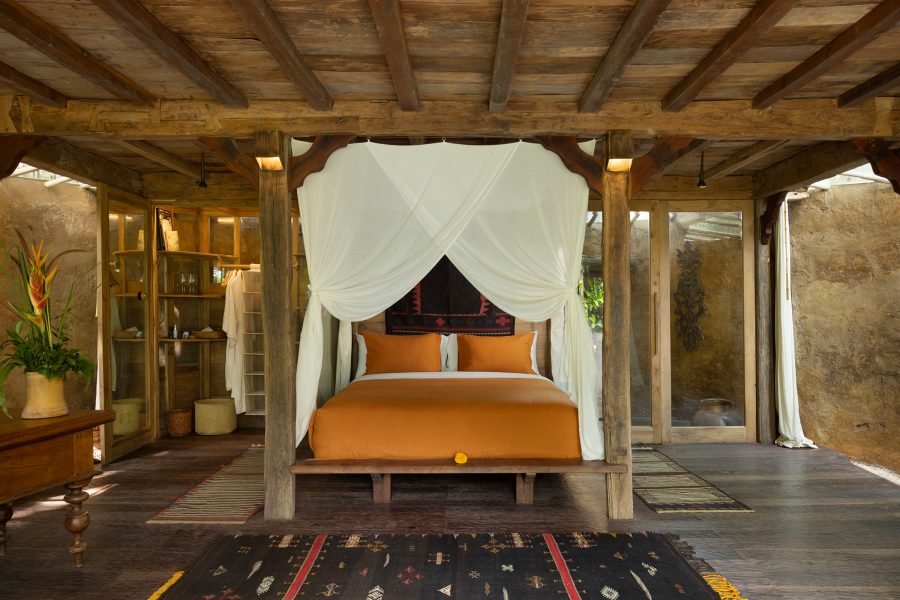 The bedroom of Jambu House at Bambu Indah, Bali, in the daytime. 