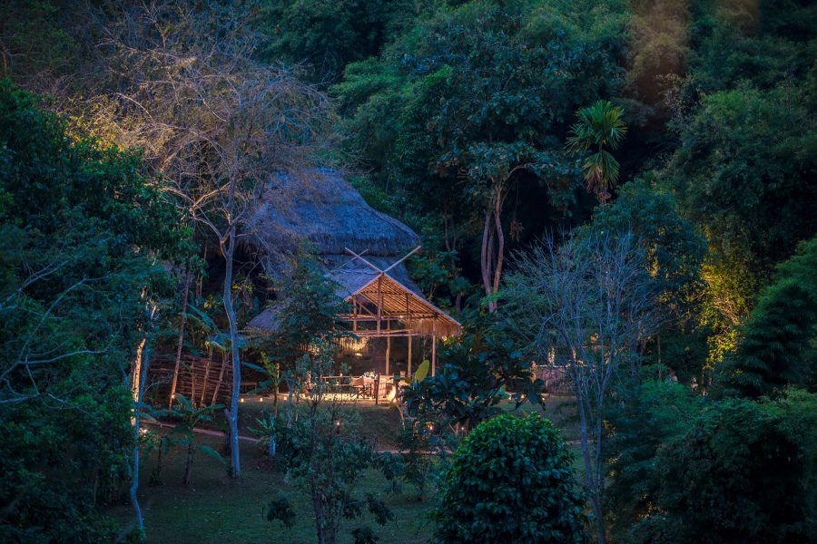 One of the lodges at Four Seasons Tented Camp Golden Triangle, Chiang Rai, at dusk. 