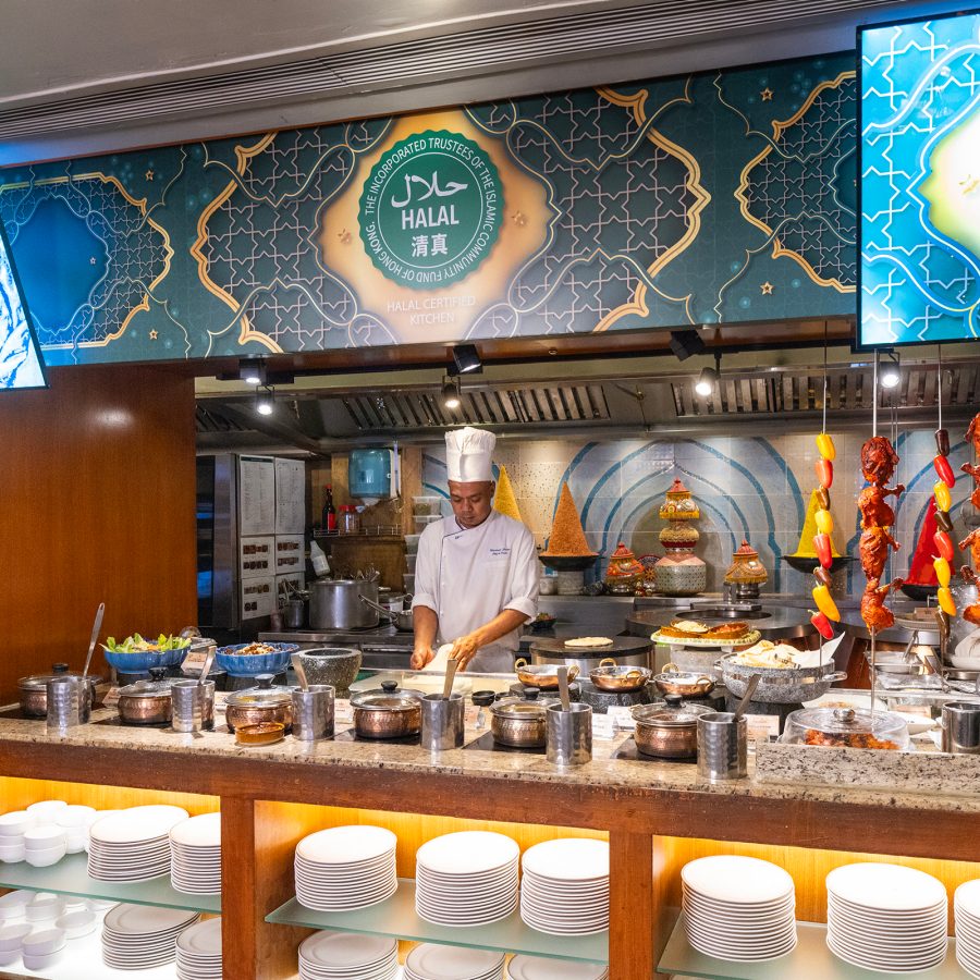 A view of the halal section of the buffet area at Cafe Kool, featuring a carving station and the halal friendly certificate framed on the wall. 