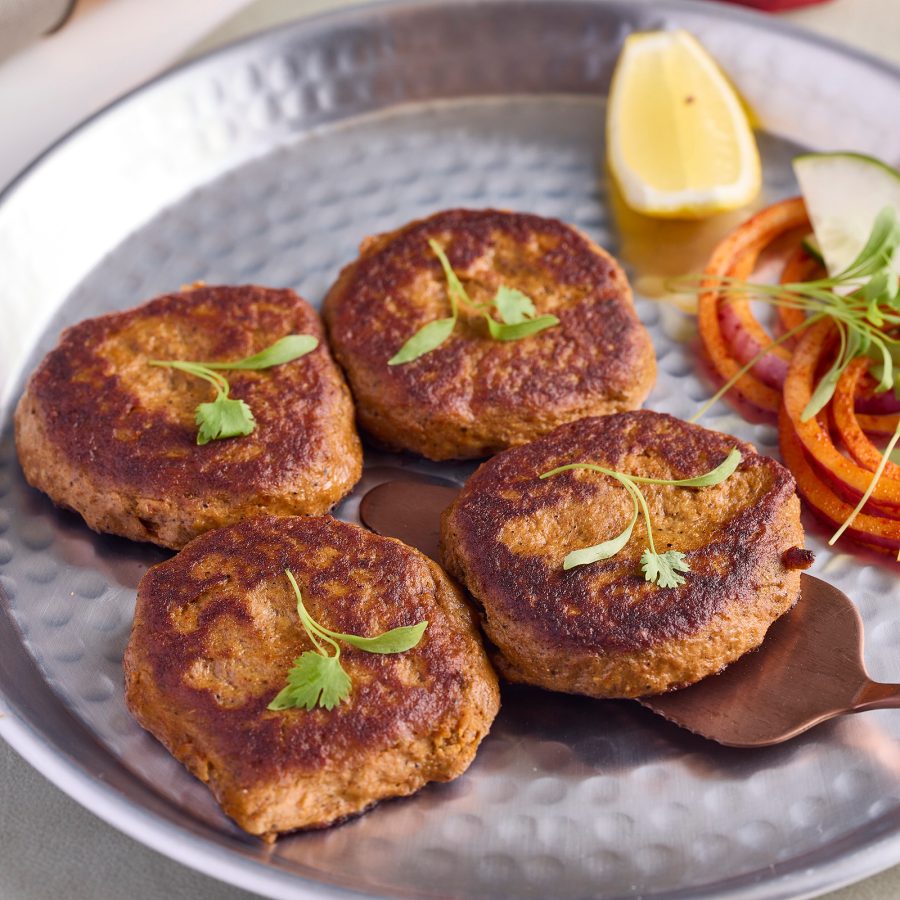 A closeup up of silver plate of Shahi Galouti Kebab, served at Bombay Dreams in Hong Kong.
