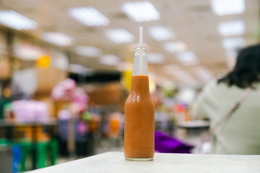 A bottle of chilled milk tea from Shui Kee Coffee at Sheung Wan Market and Cooked Food Centre.