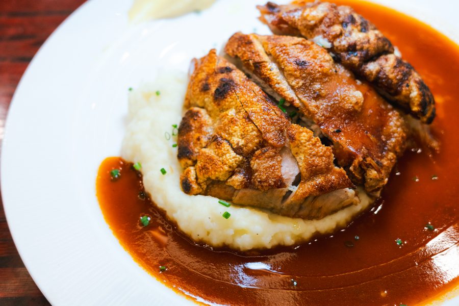 Roasted suckling pig with mashed potatoes from ABC Kitchen at Queen Street Cooked Food Market. 