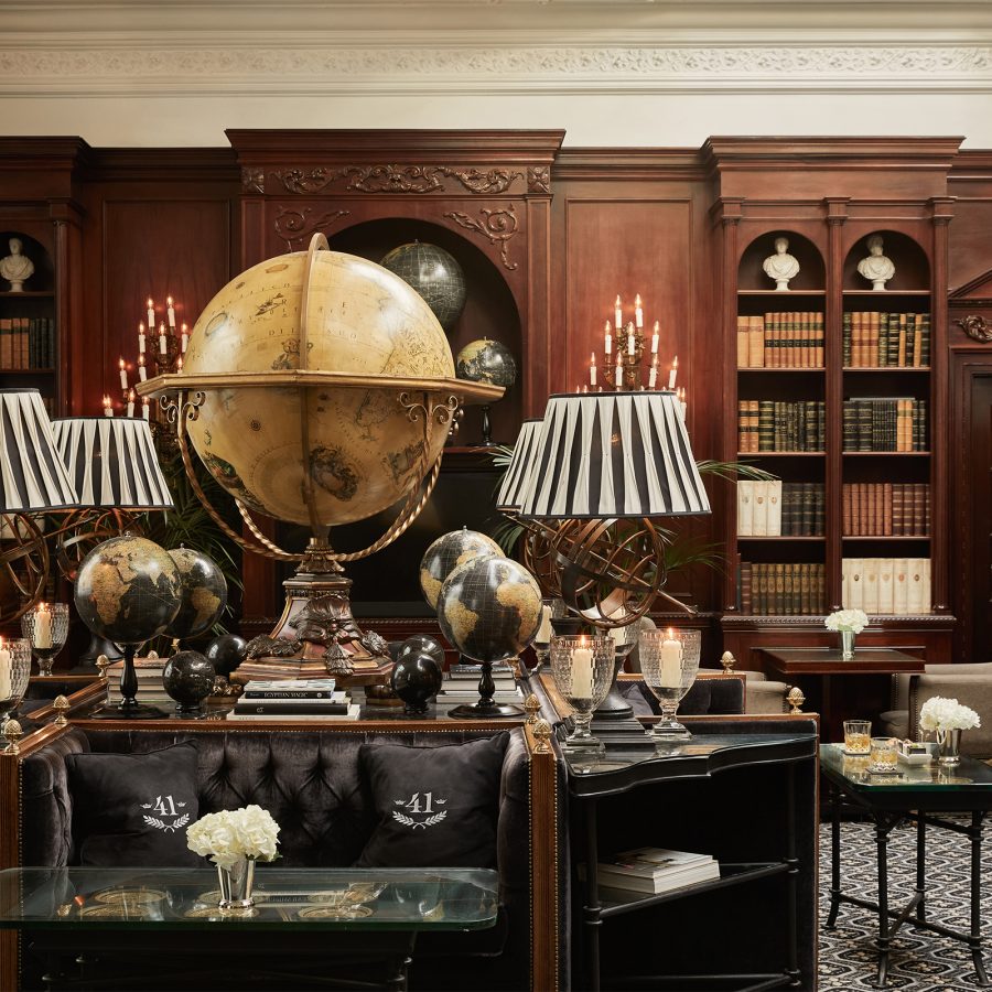 An inside view of the dark academia-themed library at Hotel 41 in London.