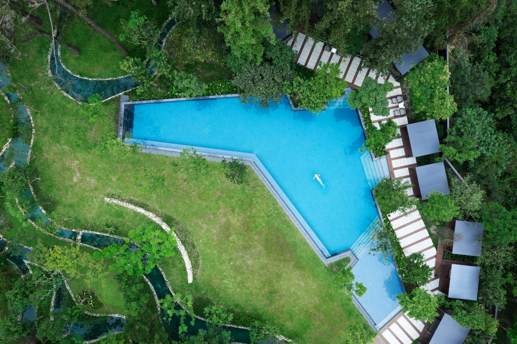 A drone shot of the outdoor swimming pool at HOSHINOYA Guguan hotel in Taichung City, Taiwan..