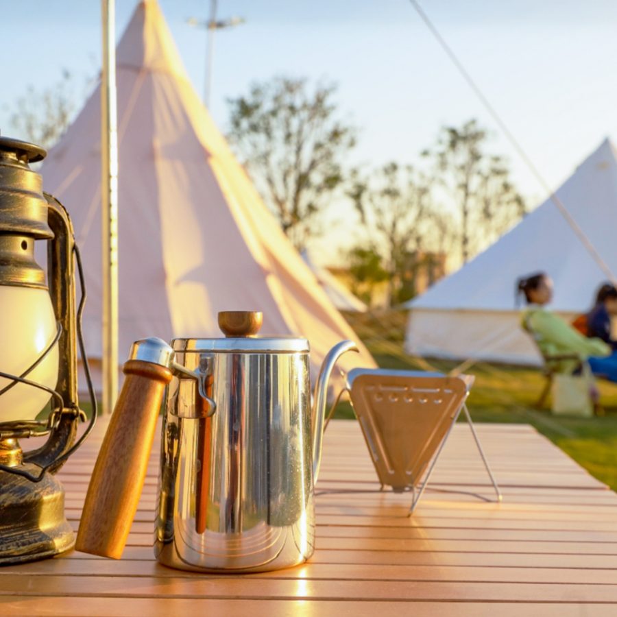 People relaxing at a campsite.