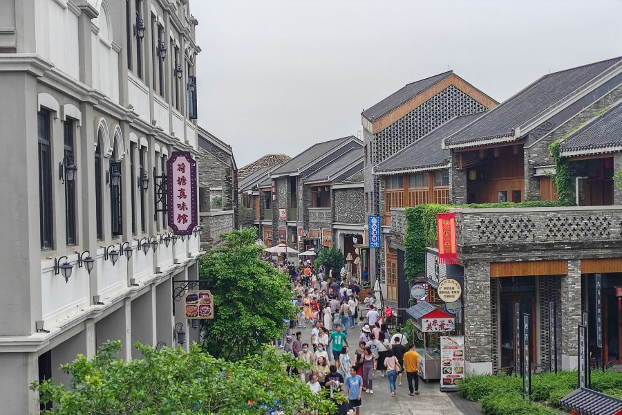 Crowds streaming through Gulouxu Waterfront Commercial Street,.