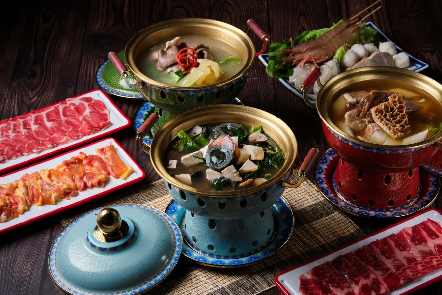 Platters of meat, seafood and fish balls along with three hotpots at Chiu Bistro, Hong Kong. 
