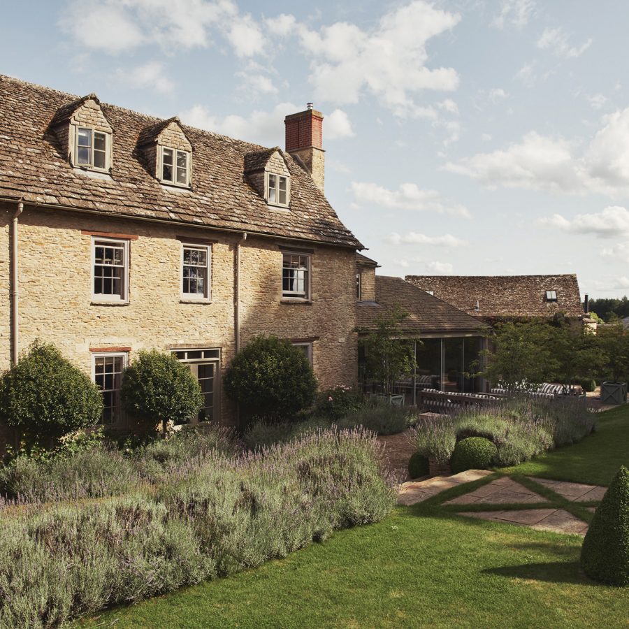 An exterior view of the farmhouse at Thyme boutique hotel in a countryside in the UK