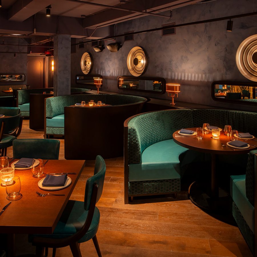 A view of the glamorous interiors and dining booths at Aqua New York restaurant