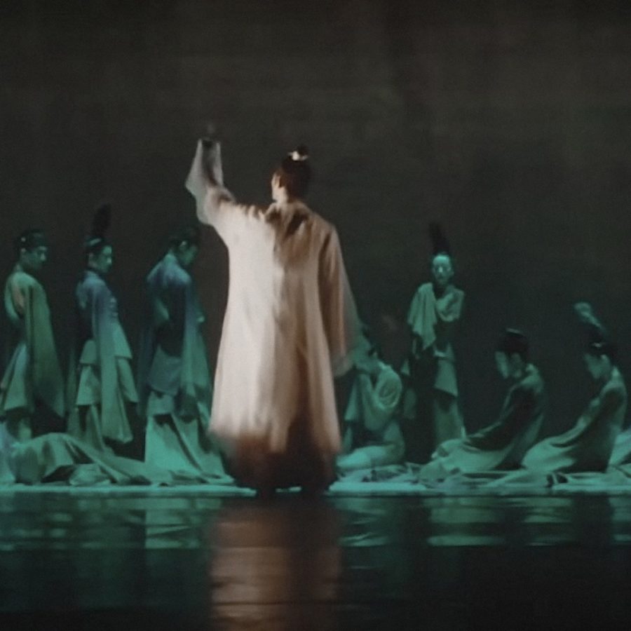 Performers in ancient Chinese costumes on stage at I Am What I Am at the Guangzhou Opera House.
