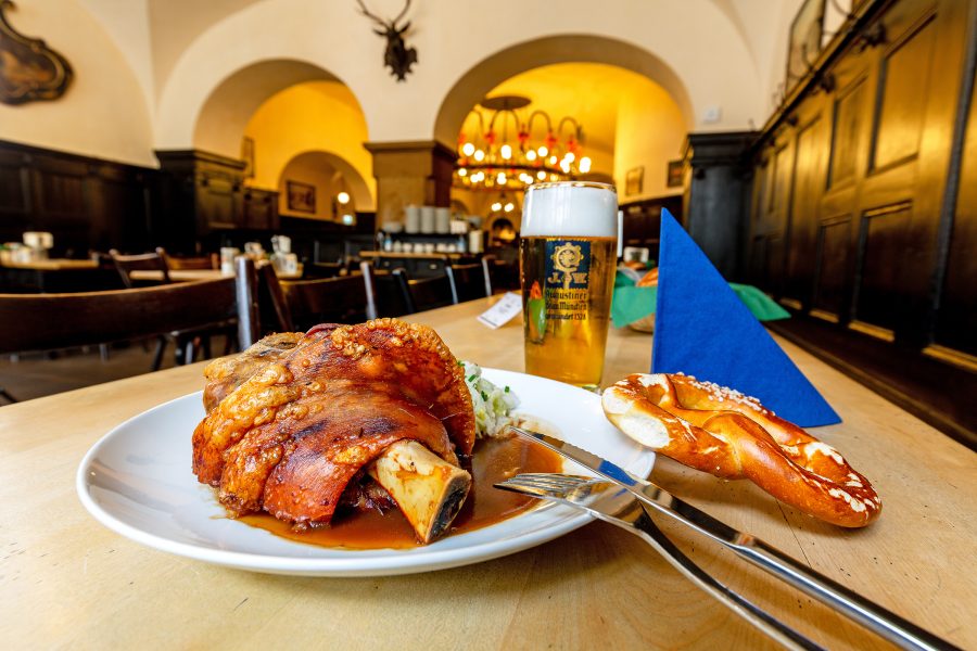 A traditional German pork knuckle dish and pretzel served at Augustiner Stammhaus in Munich.