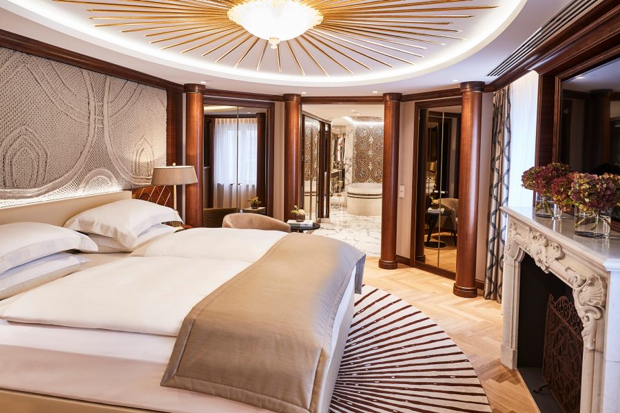 Interior bedroom shot of a hotel room at the Hotel Vier Jahreszeiten Kempinski Munich Hotel.