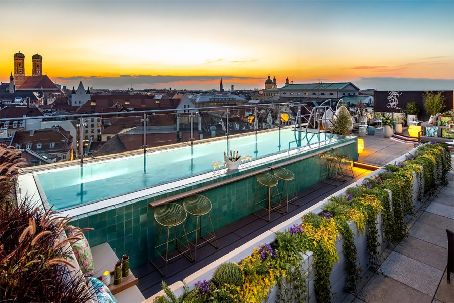 The rooftop swimming pool and bar at the Munich Mandarin Oriental at sunset.
