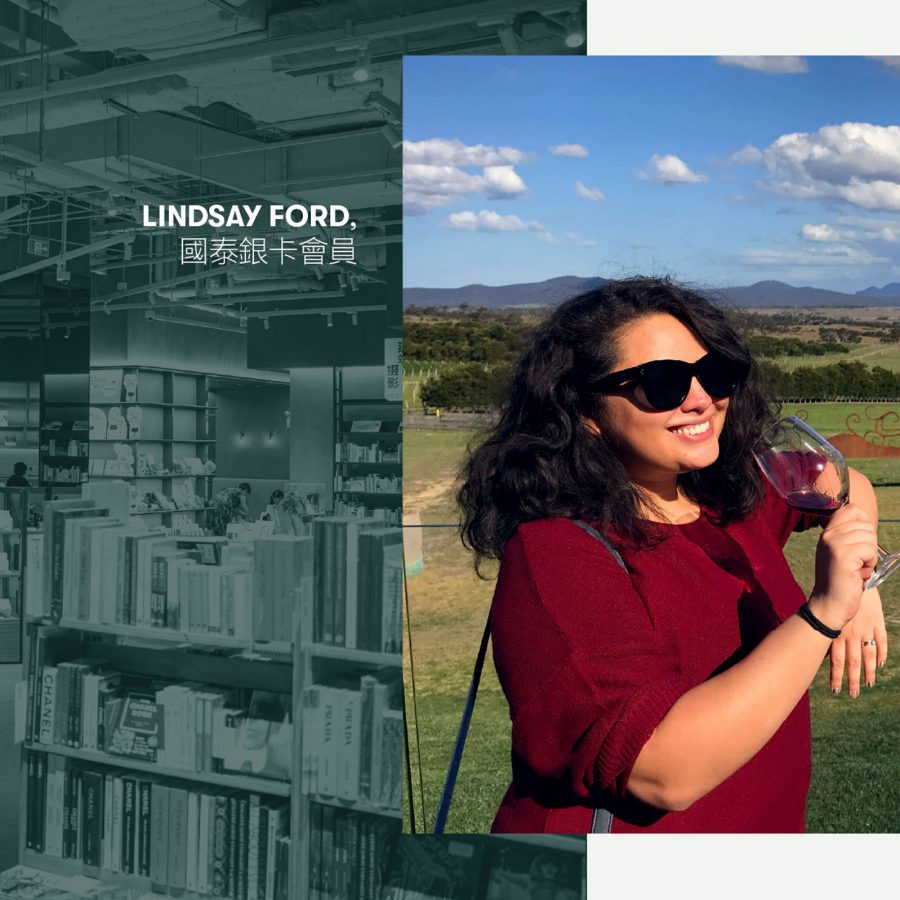 Cathay Silver Member Lindsay Ford holding a glass of wine at a vineyard