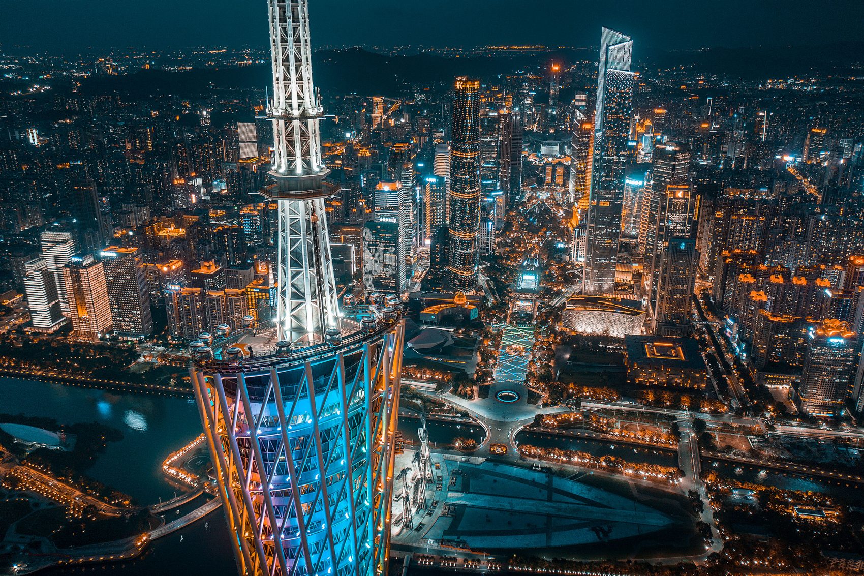 Aerial view of Guangzhou’s illuminated skyscrapers at night. Guangzhou hosts the Canton Fair twice every year.