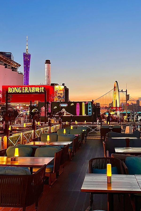 RongEra’s outdoor dining tables have views of the Canton Tower at sunset.