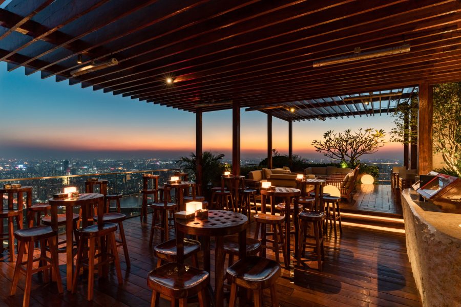 Exterior of The Roof Bar, a terrace looking out over the city of Guangzhou in the evening. 