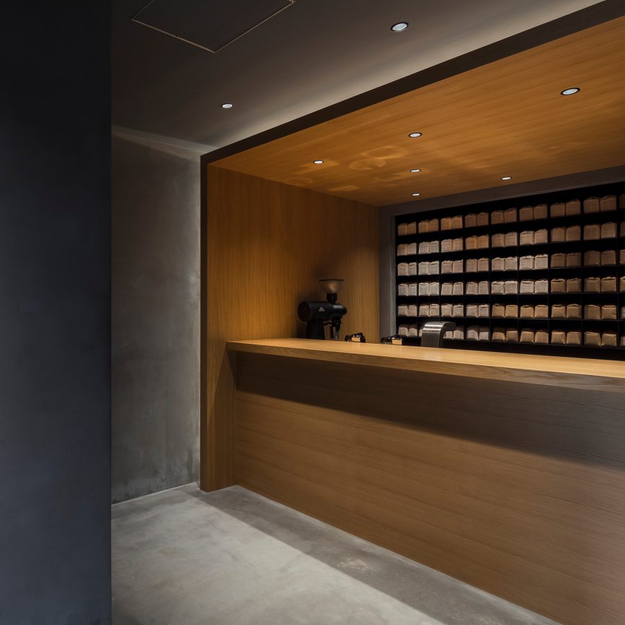 View of the counter and a plant at Koffee Mameya in Tokyo.
