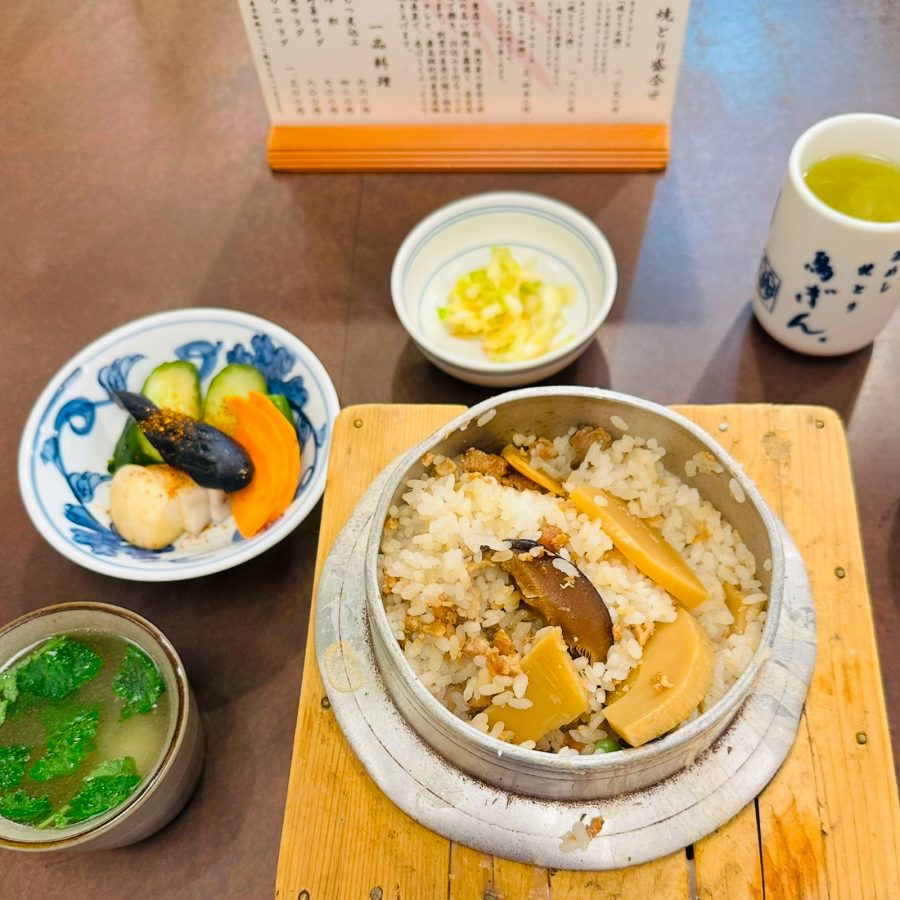 View of a kamameshi rice dish with mushrooms at Torigin Honten.