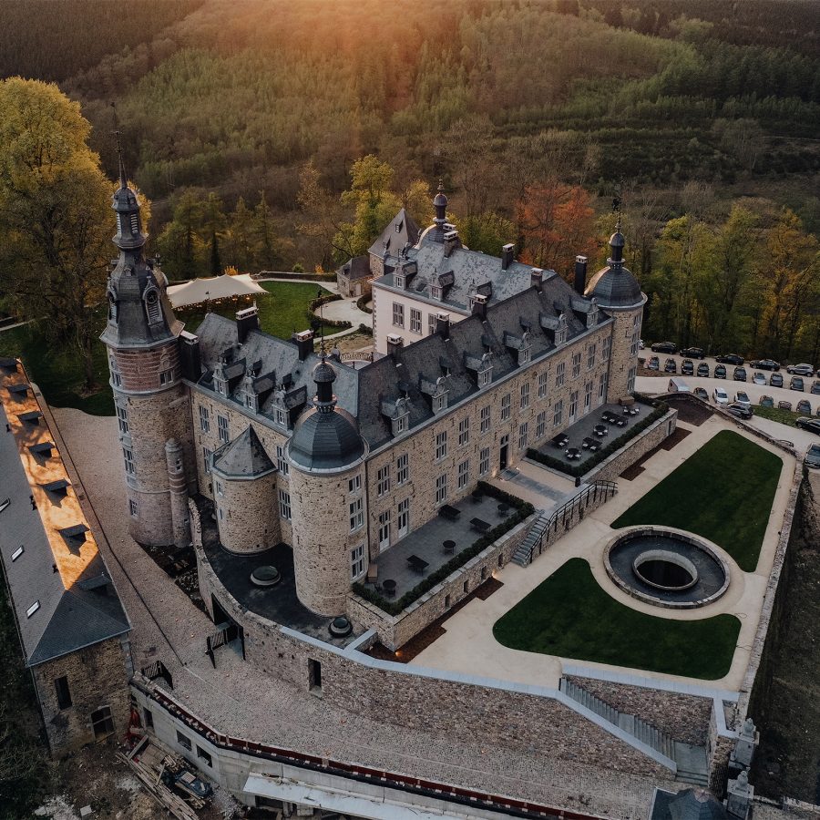 Drone shot of the Château de Mirwart at dusk in Belgium.