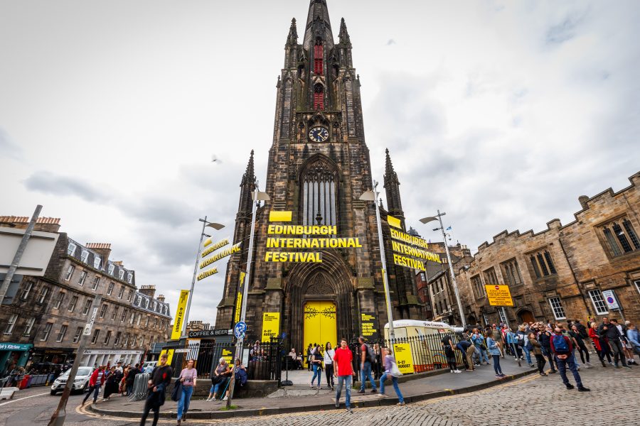 Exterior view of signage on a church in Edinburgh advertising the Edinburgh International Festival.
